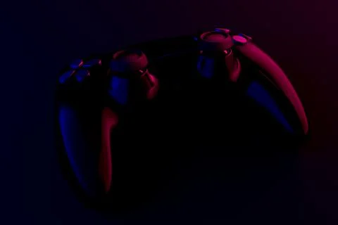 Realistic video game controller in neon lights on black noir background Stock Illustration