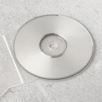 Realistic white cd template with box cover on white cement background Stock Photos