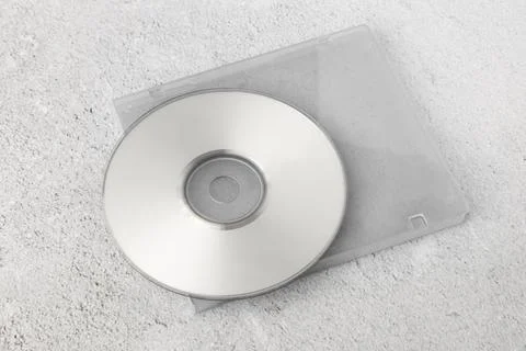 Realistic white cd template with box cover on white cement background Stock Photos