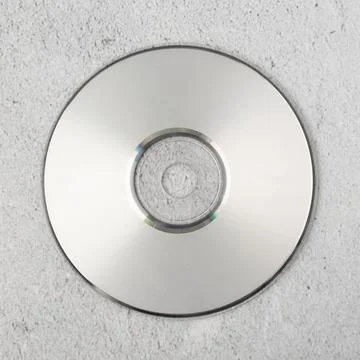 Realistic white cd template on white cement background Stock Photos
