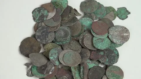 Really Old and rusty Coins from centuries ago Stock Footage 239608107