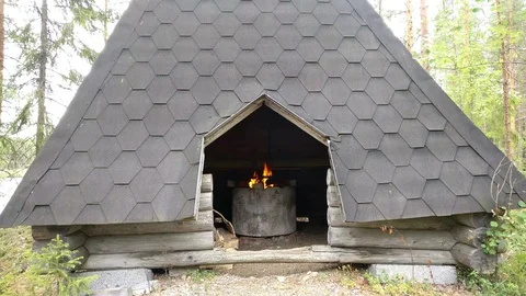 Really Old Hut and Fireplace burning Stock Footage 94607534