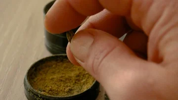 A really soft peace of hashish prepared from a brown dusty Stock Footage 85886001