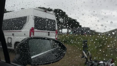 Realtime, raining car window at campsite with a van outside, sad, travel 스톡 동영상 253436711