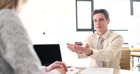 Realtor hands over model of tiny house and layout of cottage to client Stock Footage 275135818