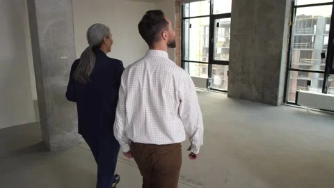 Realtor showing flat and view from window to buyer Stock Footage 149075448