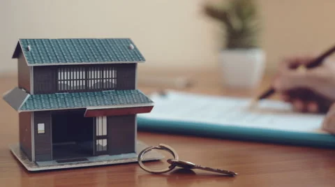 Realtor signing contract Stock Footage 65037360