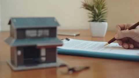 Realtor signing contract Stock Footage 65037363