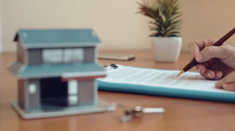 Realtor signing contract Stock Footage 65037489