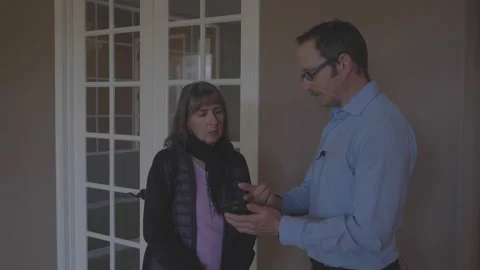 A realtor talking and sharing information with a client Stock Footage 231691421