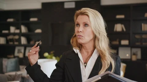 Realtor talking to a client at open house Stock Footage 101622716