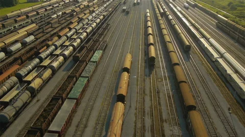 Rear Aerial view of freight train depot Vídeo Stock 44974034