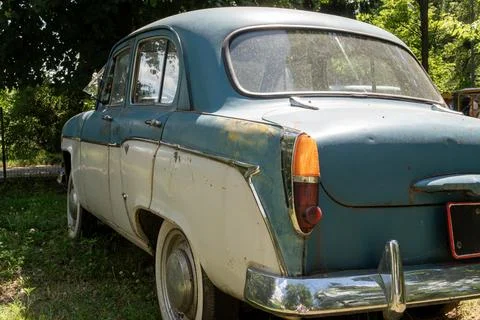 Rear Angle View of Two Tone Vintage Soviet Sedan Parked Outdoors Stock Photos