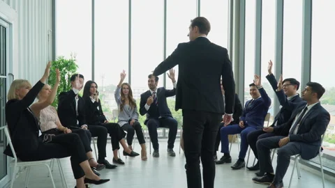 Rear back view of businessman standing giving a speech addressing a conferenc Stock Footage 162182636