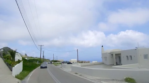 Rear back view of car driving on country mountain road with clouds in background Stock Footage 92441602