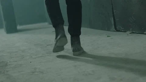 Rear Back View Of Man Walking Inside Dar... | Stock Video | Pond5