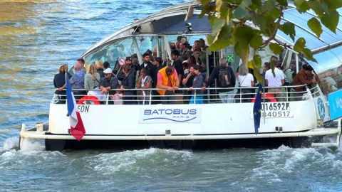 Rear of a Batobus navigating the Seine on a sunny autumn afternoon Video stock 337343820