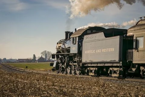 Rear Close Up View of a Classic Steam Locomotive Traveling Thru the Countryside Stock Photos