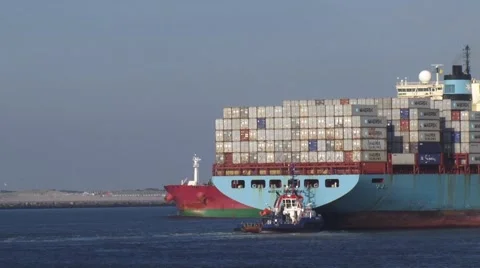 Rear container ship, navigates inbound assisted by tugs Stock Footage 58100429