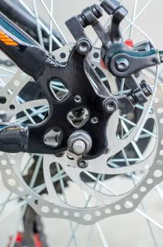 Rear disc brake system close-up on a bicycle. Stock Photos