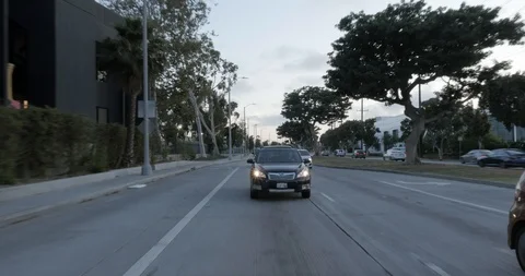 Rear driving plate - Olympic Blvd at Stewart St, Culver City Stock Footage 101714539