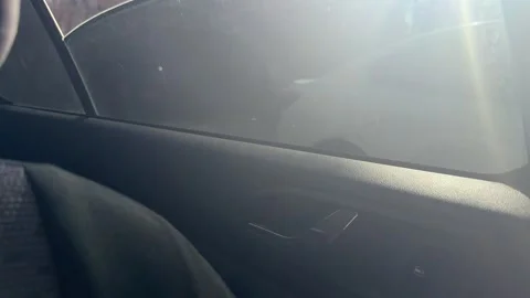 Rear electric car window rises inside the passenger door, powered glass Stock Footage 337114935