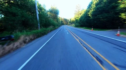 Rear Facing Motion Lapse of Car Driving Down Wooded Road (Color Graded) Stock Footage 246676099