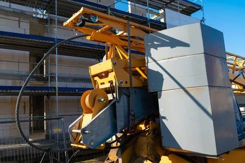Rear of folded construction crane at the construction site Stock Photos