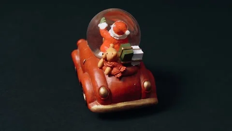 Rear frame of the toy in the shape of a retro car, in which Santa Claus carries Video stock 159558361
