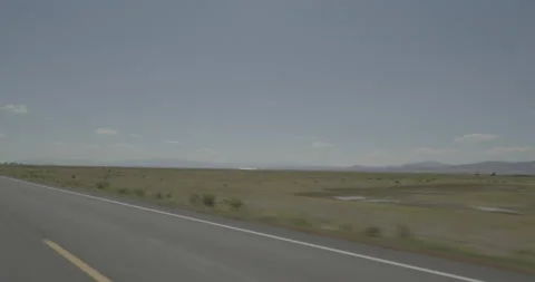 Rear left driving plate - Highway 285 at Mile 74 Saguache County Vídeos de archivo 288821235