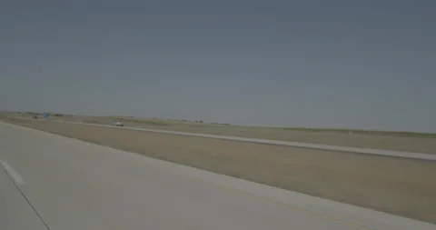 Rear left driving plate - Highway 90 at Mile 368 McCook County Stock Footage 290837553