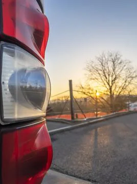 The rear light of the bus at sunset Stock Photos