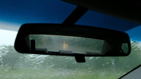 Rear mirror view inside car during heavy rain 스톡 동영상 119135370
