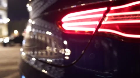 Rear nameplates of the car from which the light is reflected. Stock Footage 150106783