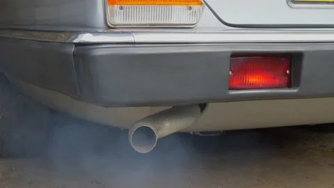 Rear of an old car being started – fumes from the exhaust tailpipe. Stock-Footage 154733715