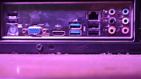 Rear panel of computer motherboard with various peripheral ports in purple .. Stock Footage 335062146