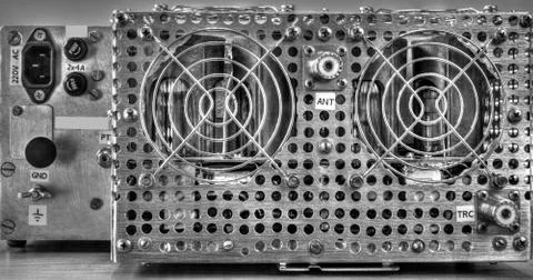 Rear panel of a high frequency power amplifier in black and white Foto stock