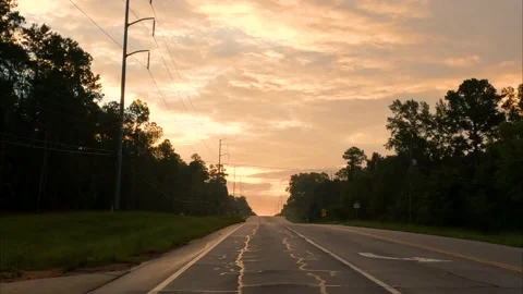 Rear POV camera driving moody dramatic sky early morning no traffic Stock Footage 225562053