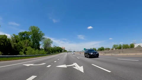 Rear POV view traffic fast moving cars and motorcycle Bobby Jones Expressway Stock Footage 181640784