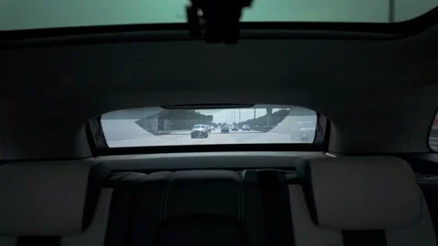 Rear seat view through windshield at trailing traffic on multi-lane highway Stock-Footage 339885791