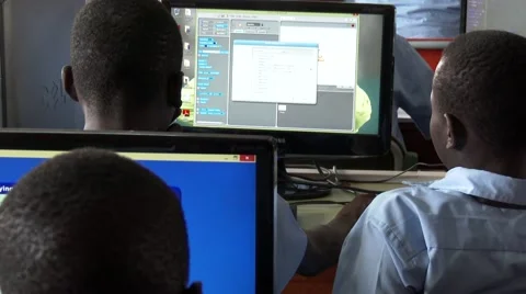 Rear shot of African students at computer lab in school-Education in Africa Stock Footage 58974387