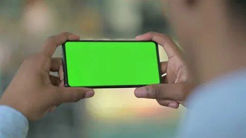 Rear View of African Man Looking at Smartphone with Chroma Screen 스톡 동영상 138301846