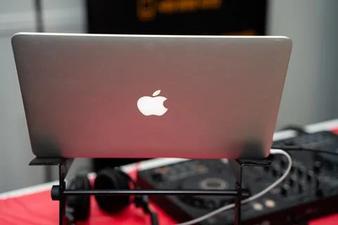 Rear view of Apple MacBook laptop on DJ stand. Toronto, Canada - February 27, Stock Photos