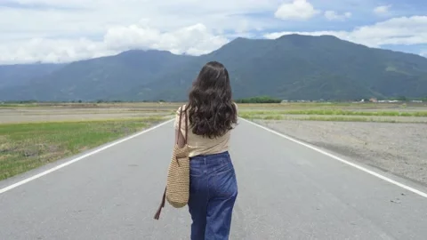 Rear view asian lady is pushing back her hair Stock Footage 150811644