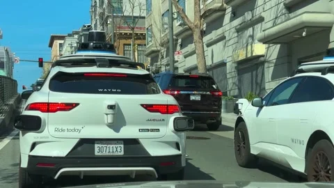 Rear View of Autonomous SUV in Traffic Stock Footage 308752935
