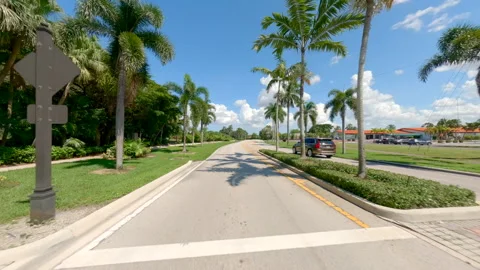 Rear view b roll driving plates traffic circle Weston Florida 2024 Stock Footage 284781714