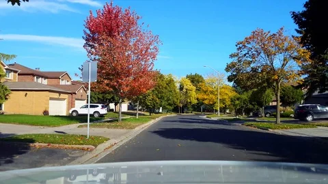 Rear View From Back of Car Driving Along Suburb Road in Day. Stock Footage 117941380