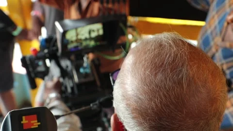 Rear view of Bald head Cameraman Stock Footage 301211536