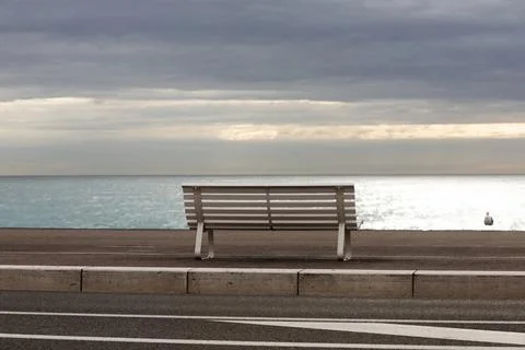 Rear view of bench on beach, Nice, Alpes-Maritimes, France Stock-Fotos