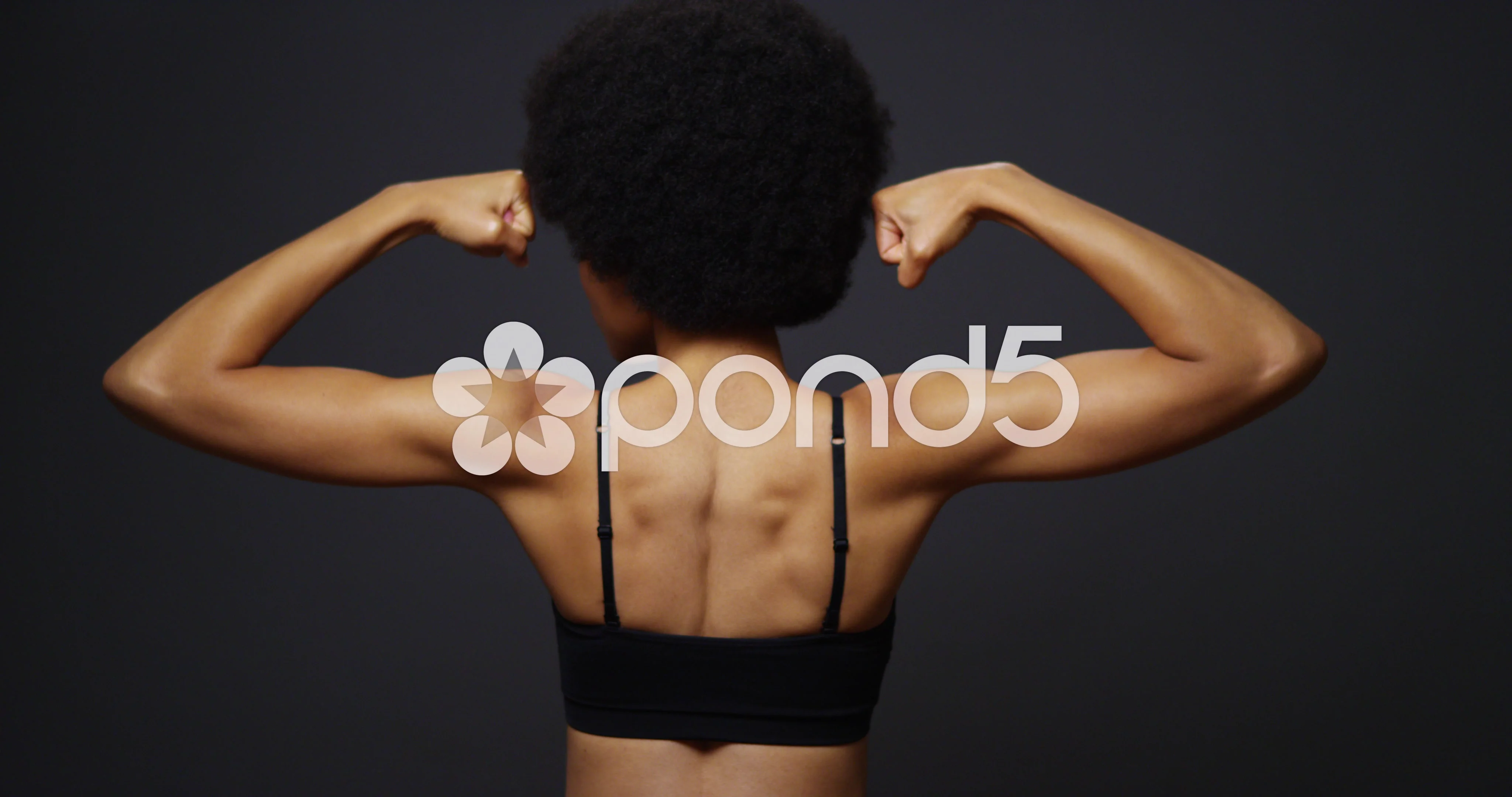 Rear view of Black woman flexing muscles, Stock Video